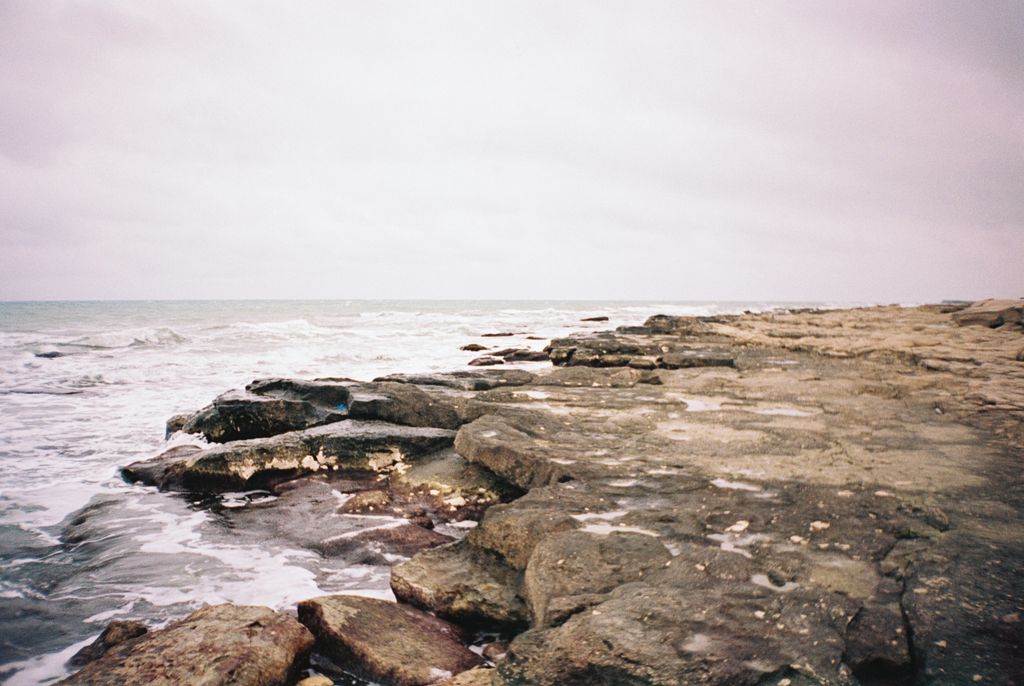 Dramatic seascape showcasing the rocky shoreline of Aktau, Kazakhstan.